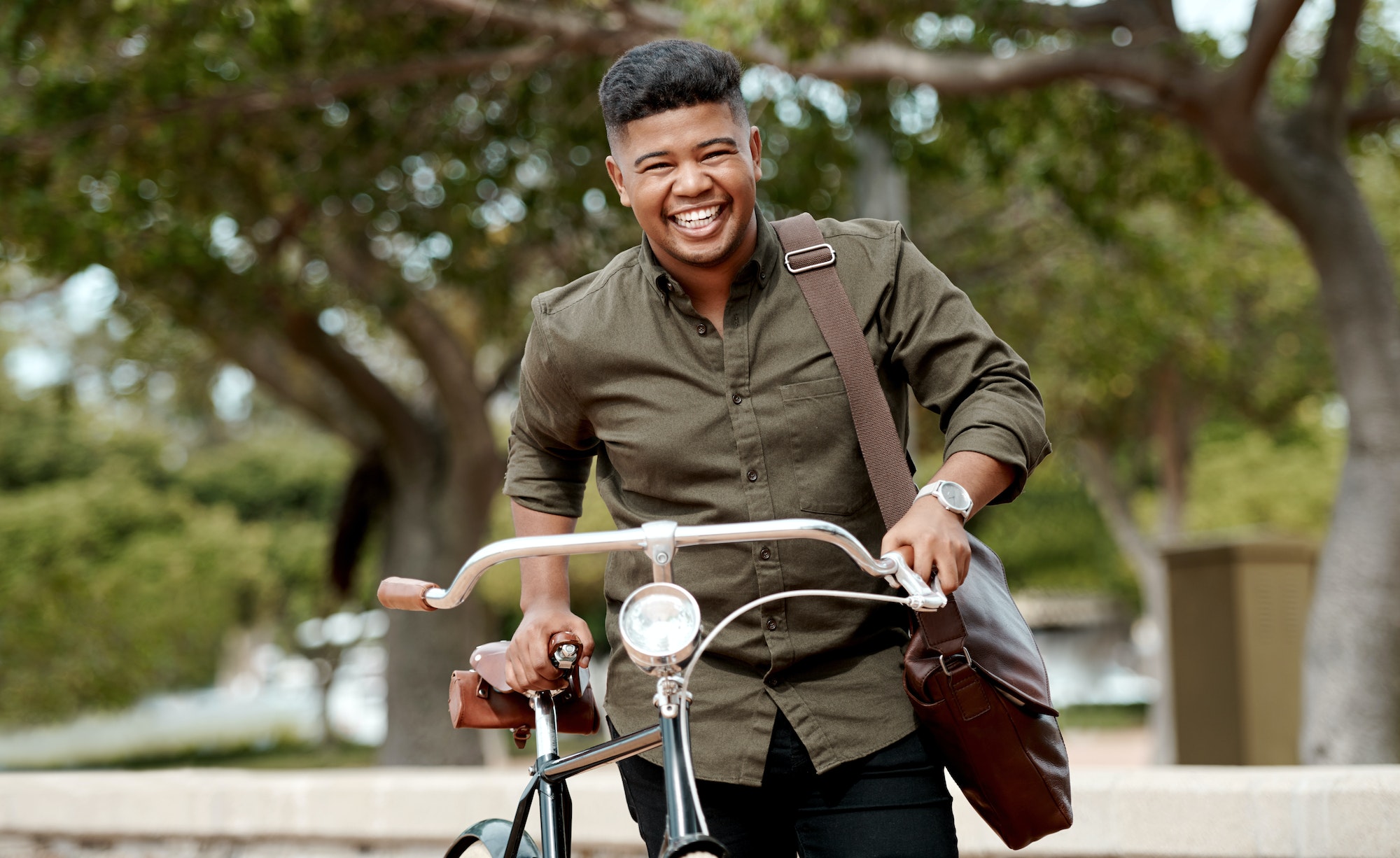 Sustainability starts with you. Shot of a young businessman riding a bicycle in the city.